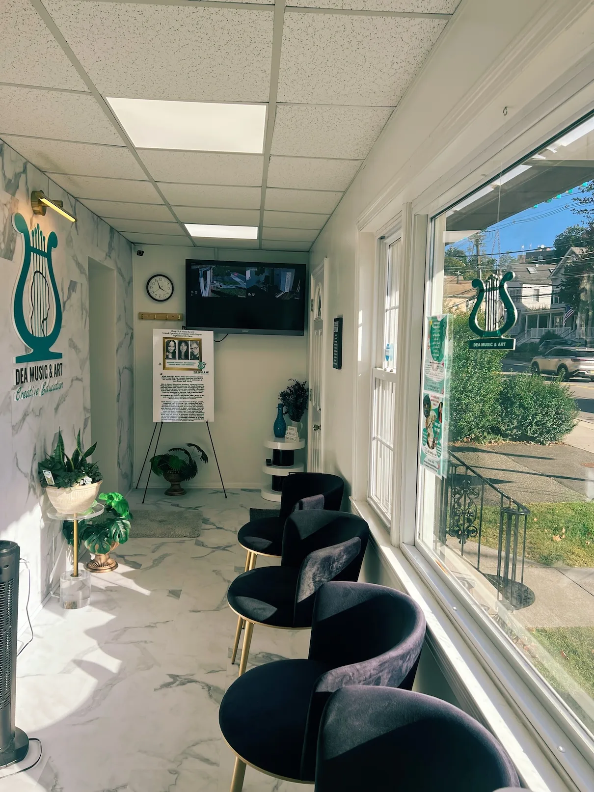 Sunlit lobby and seating at DEA Music and Art Morristown