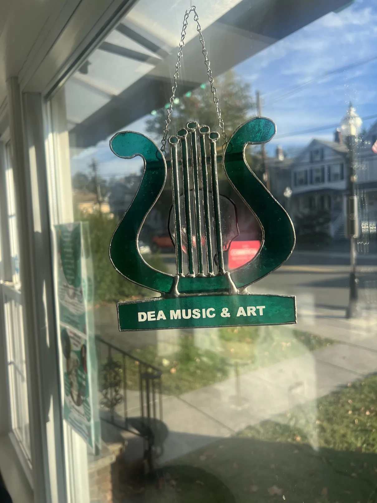 DEA Music and Art sign in the Morristown studio window